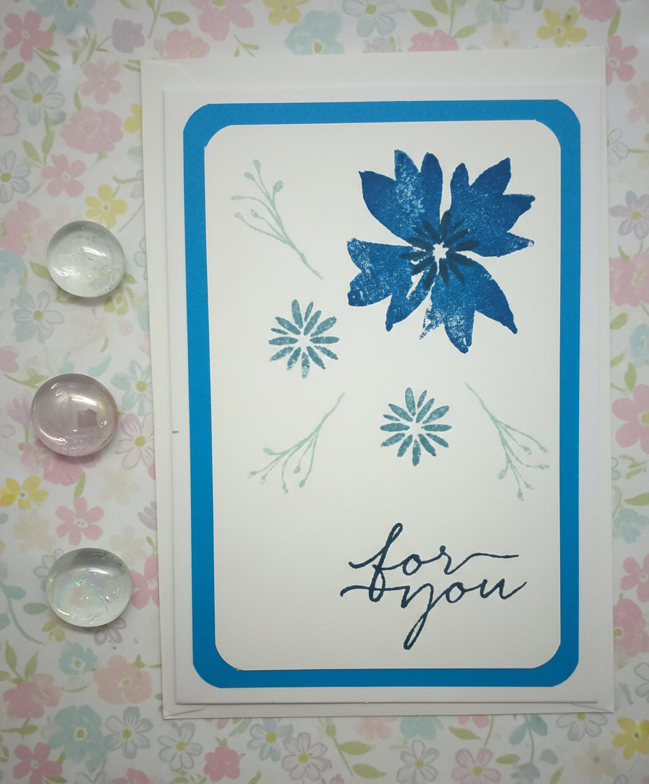 Card with blue floral design and 'for you' text on a floral background