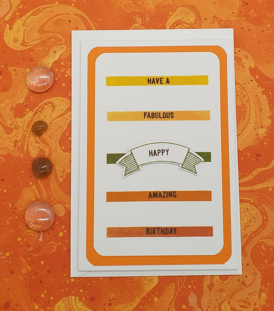 Birthday card with decorative text on an orange background