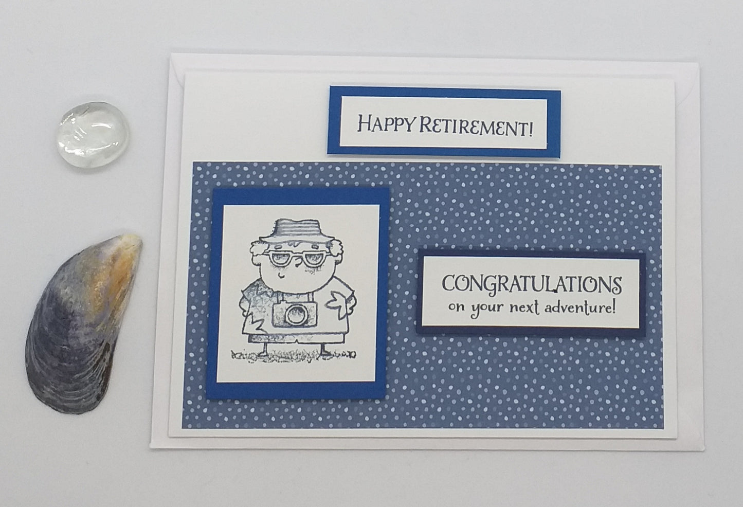Retirement card with beach scenery, palm trees, and a shell.