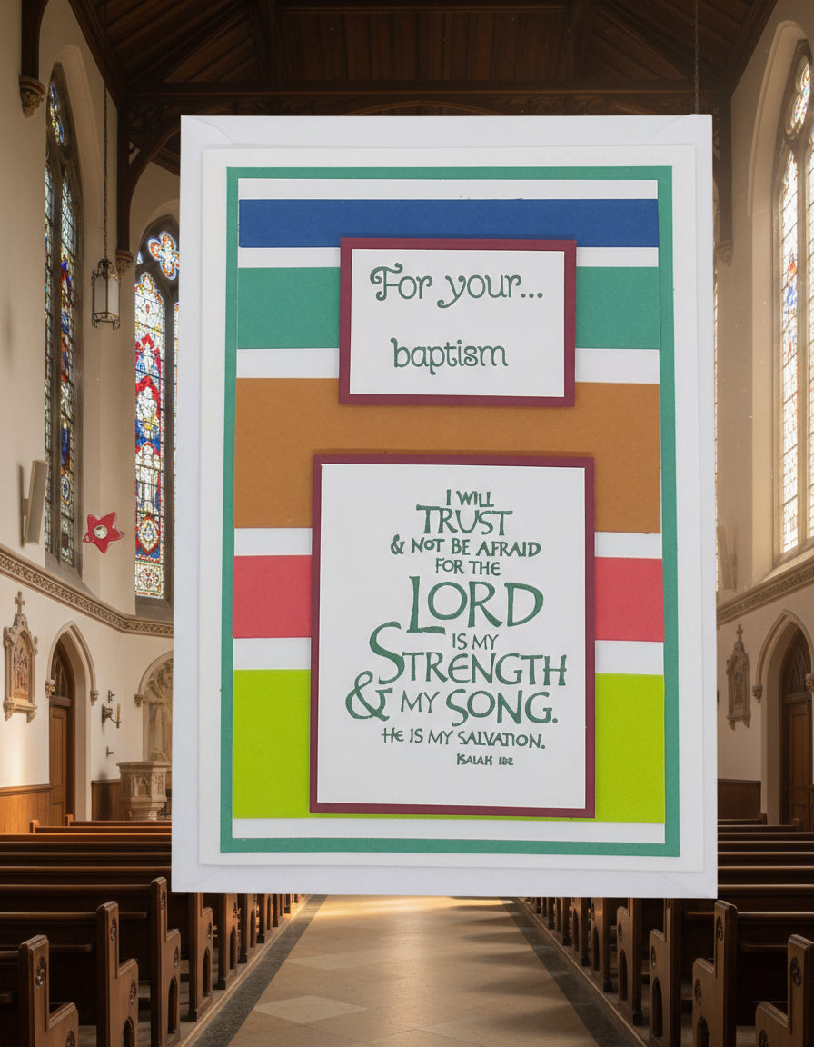 A colorful A6 greeting card with a religious baptism theme, featuring a green and red striped background, a white text that reads 'The Lord is Your Strength.