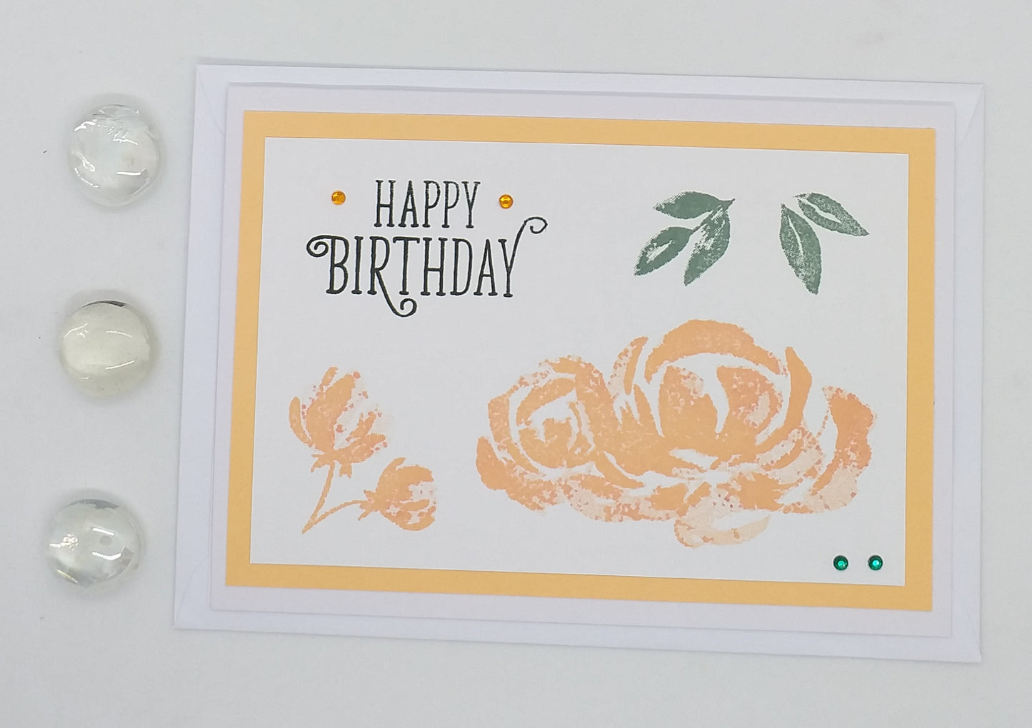 Birthday card with floral design and 'Happy Birthday' text on a floral background