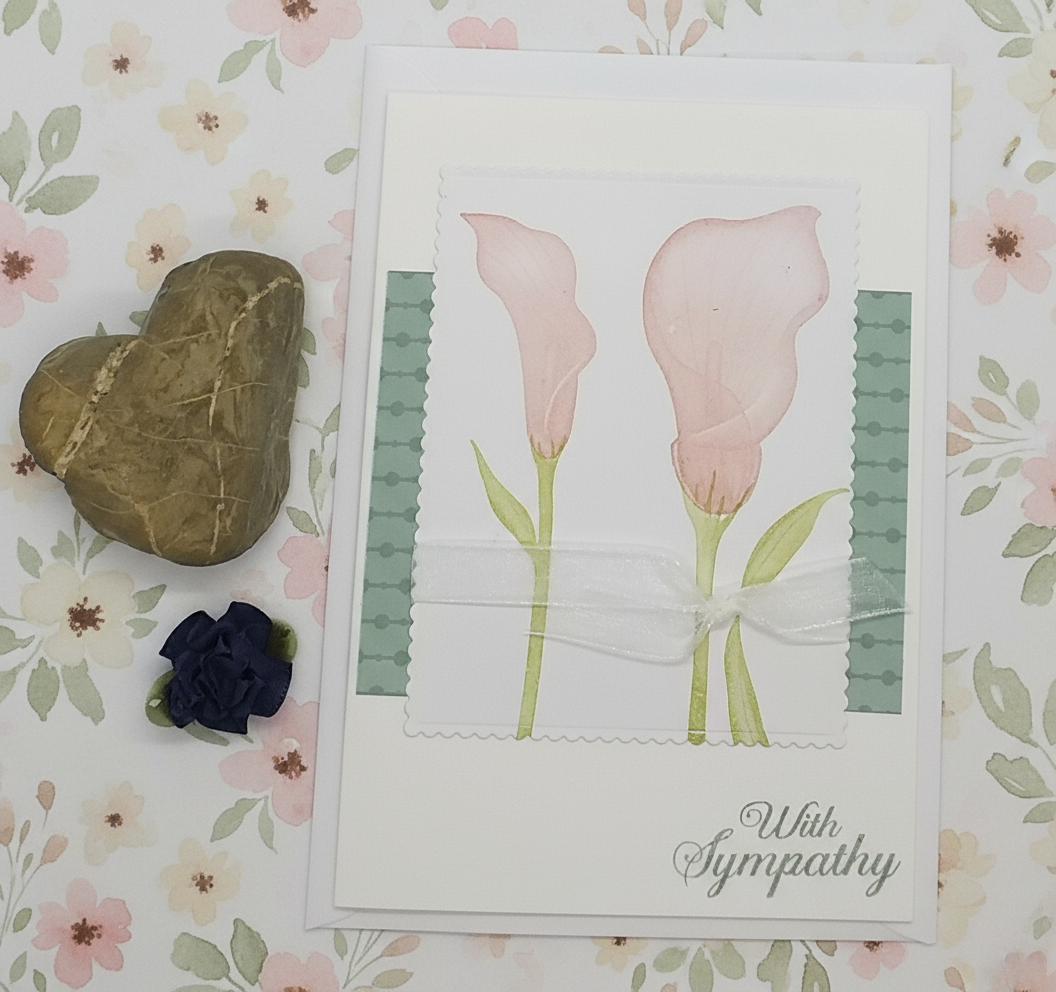 Sympathy card with pink lilies on a floral background