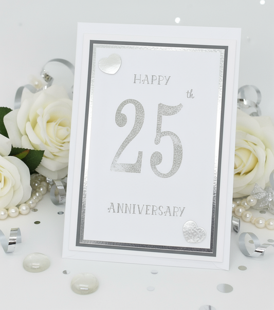 A white 25th anniversary card with 'Happy 25th Anniversary' text in silver, along with small crystal embellishments.