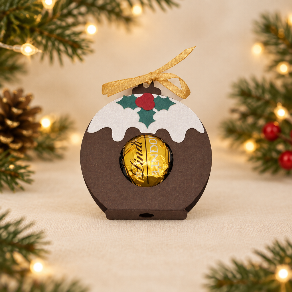 Handmade Christmas pudding holder with a Lindor dark chocolate truffle, holly, berries and gold ribbon