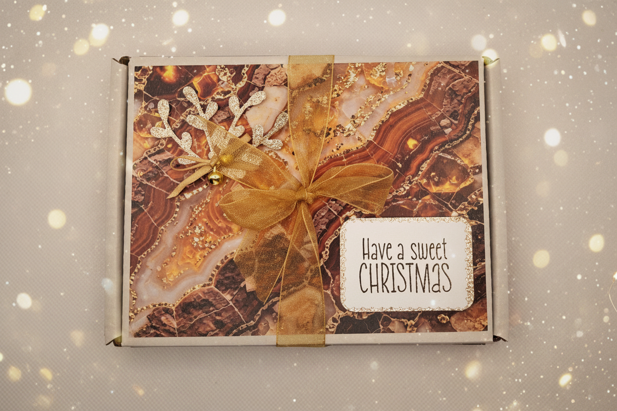 Copper and gold Divine Christmas chocolate gift box with amber-toned decoration, gold ribbon and Have a Sweet Christmas sentiment