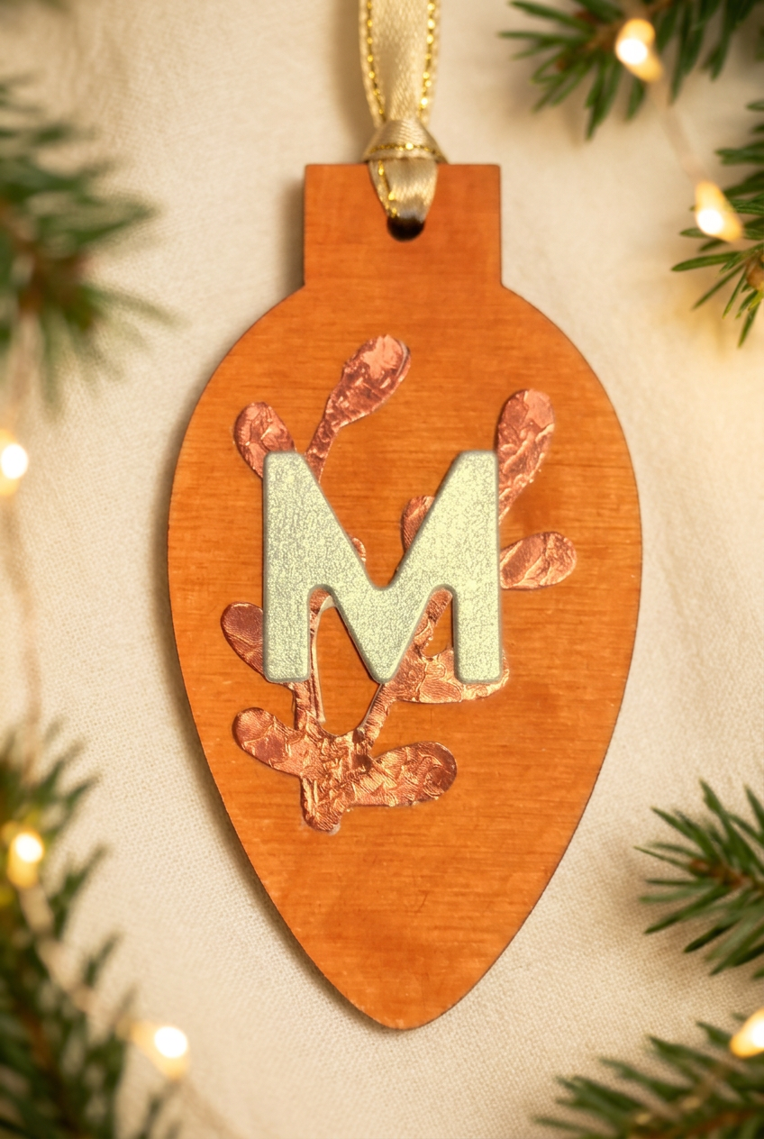 Orange wooden bulb detail with festive background